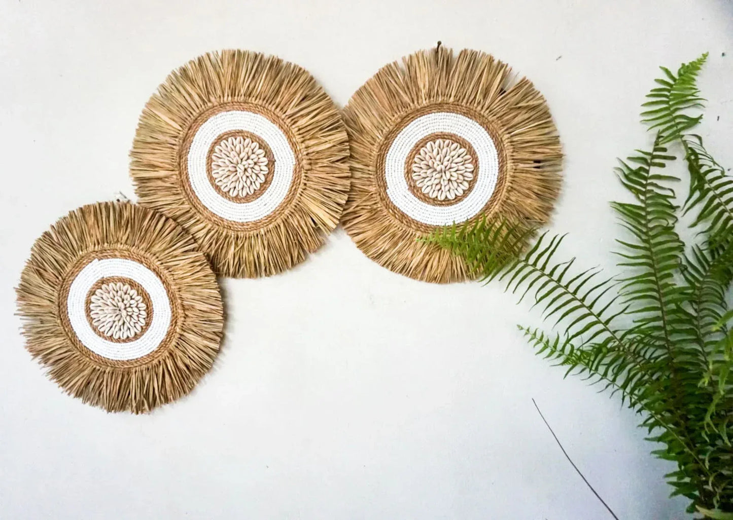 White seagrass beads round wall decor
