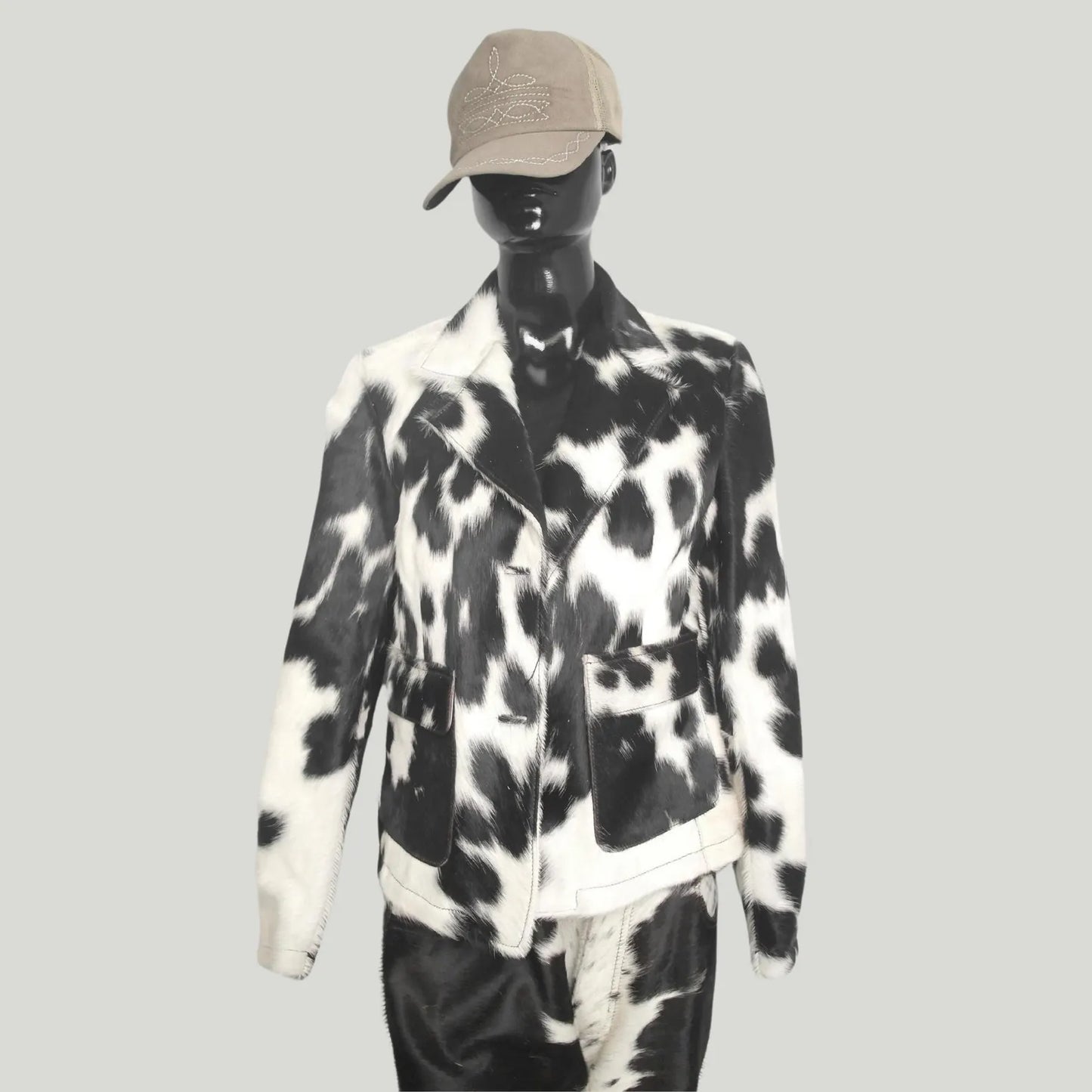 Black white cowhide fur coat for men and women. Genuine cowhide jacket perfect for rodeo, western wear, and winter warmth with unique hide patterns.