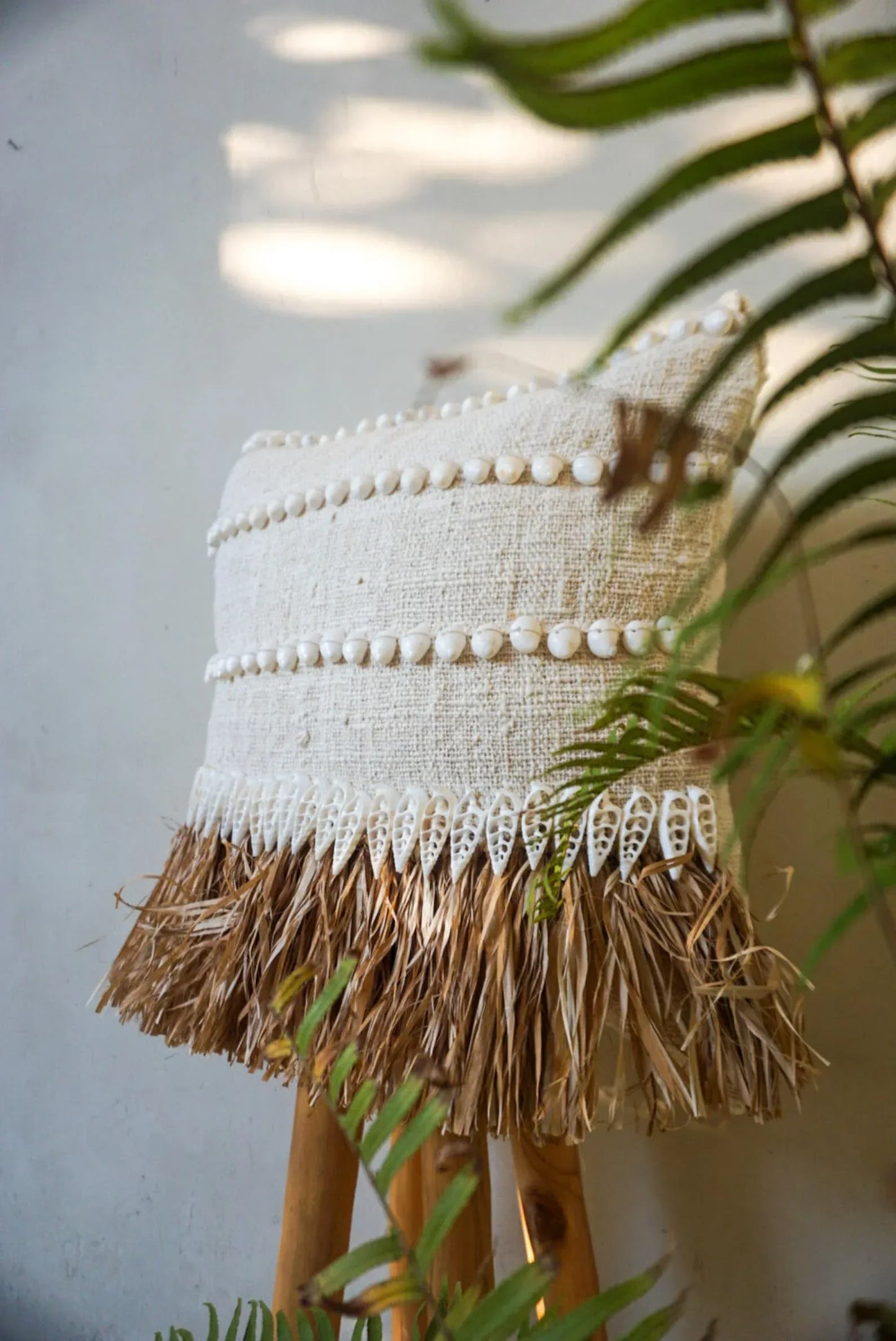Natural raffia and white shells pillow cover
