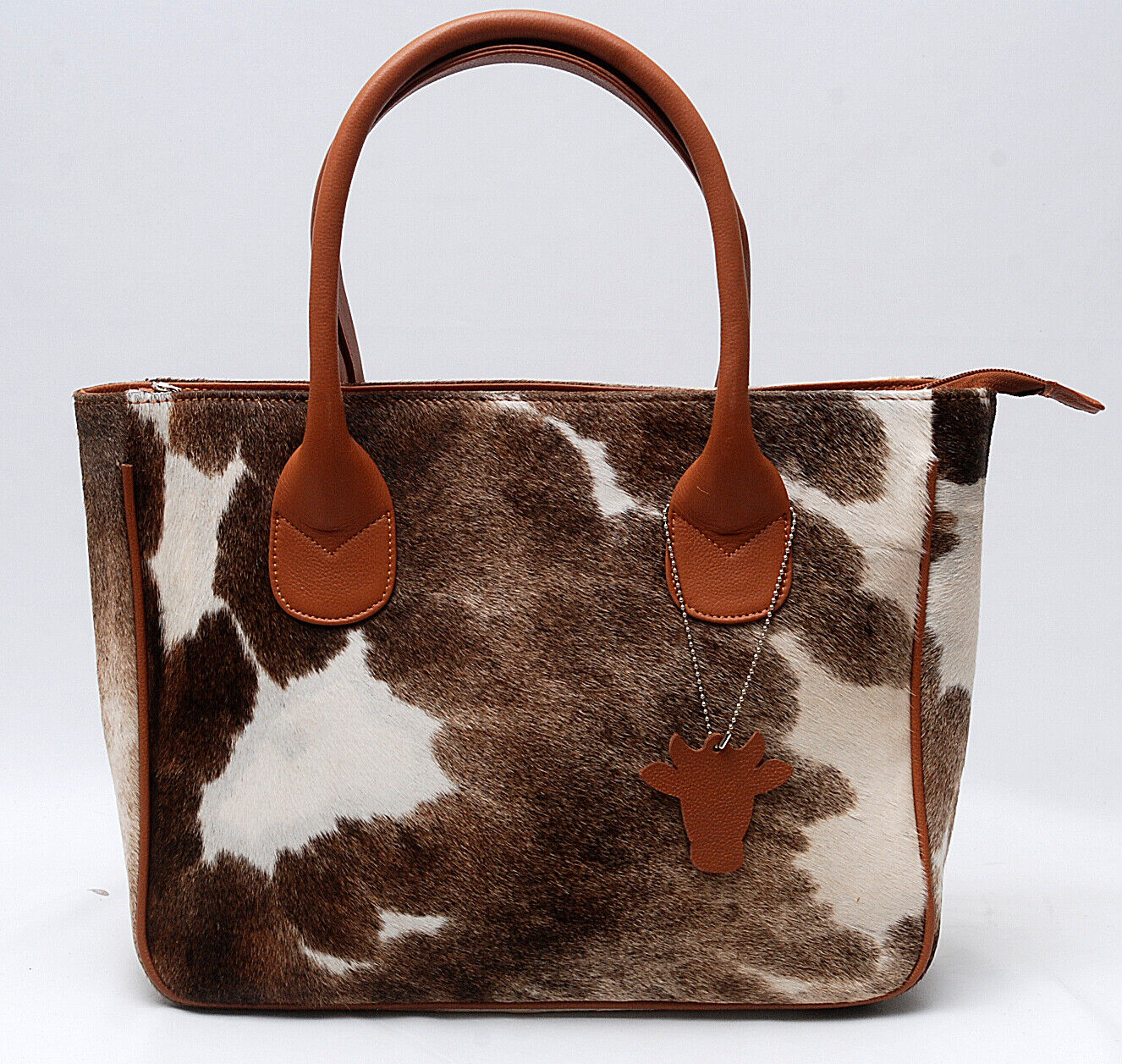 Carry a piece of nature with you with our natural cowhide tote bag.