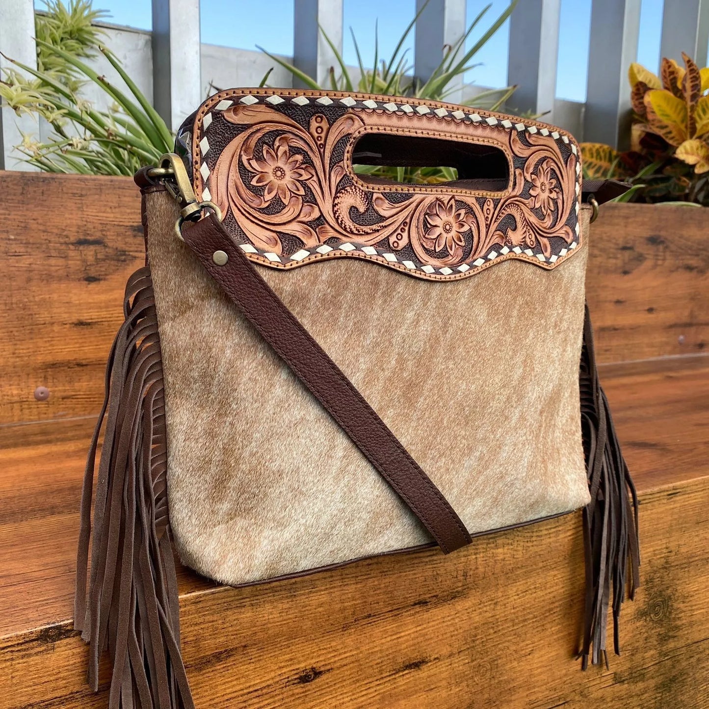 hair on cowhide and leather tooled messenger bag