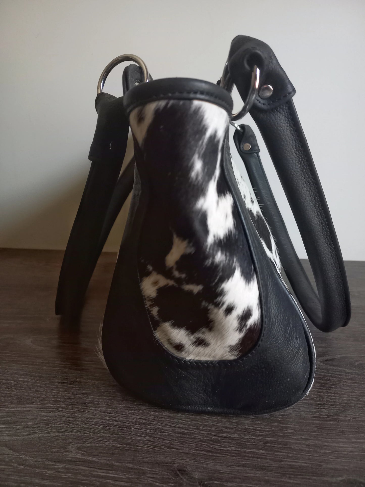 Black and white cowhide shoulder purse