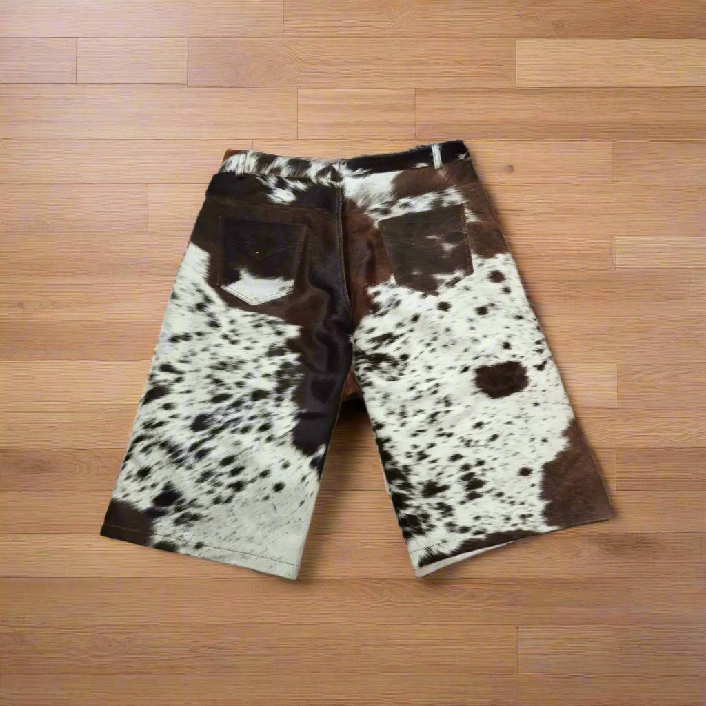 Authentic hair-on cowhide shorts for men with wide-leg fit and raw cow print pattern. A rugged choice for rodeo, ranchwear, or cowboy-inspired fashion.