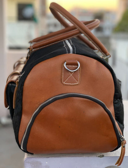 Embrace the journey with this cowhide duffle bag, crafted to withstand the challenges of your explorations.