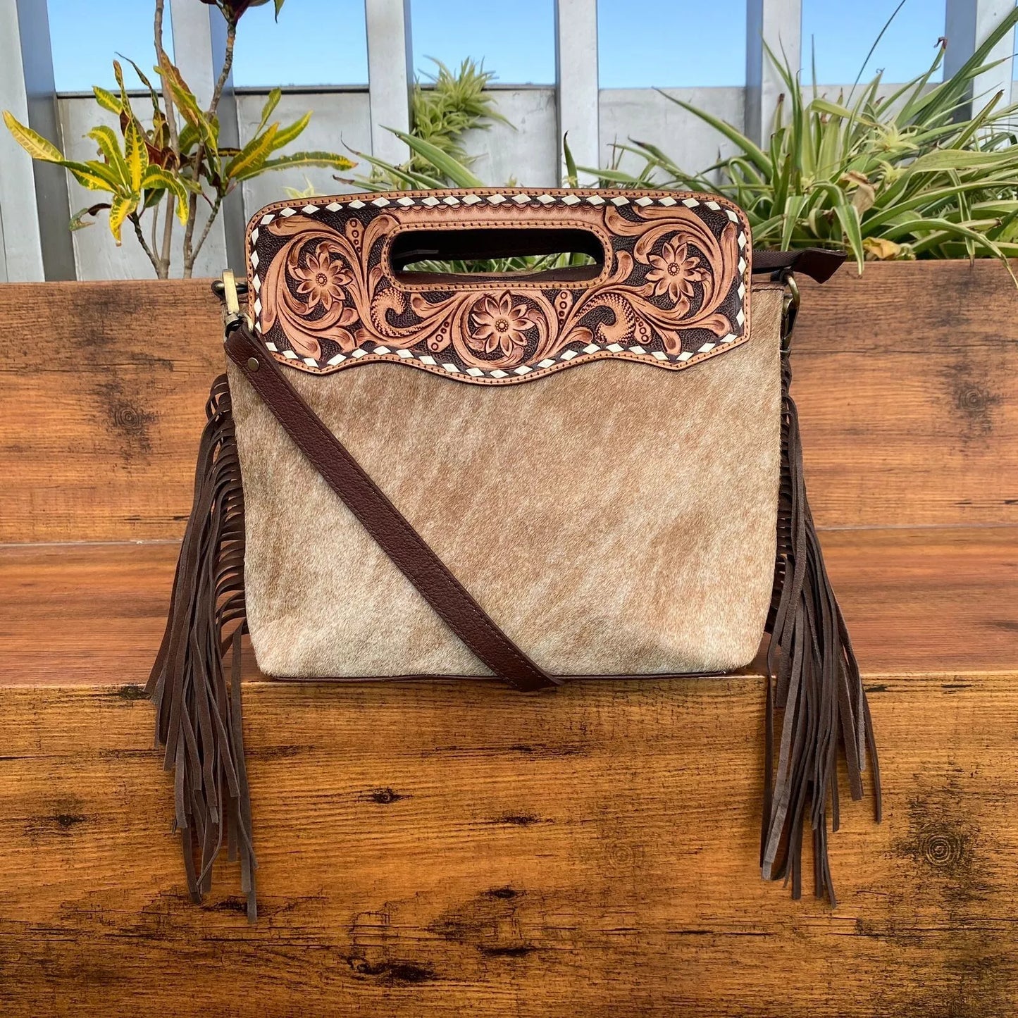 hair on cowhide and leather tooled messenger bag