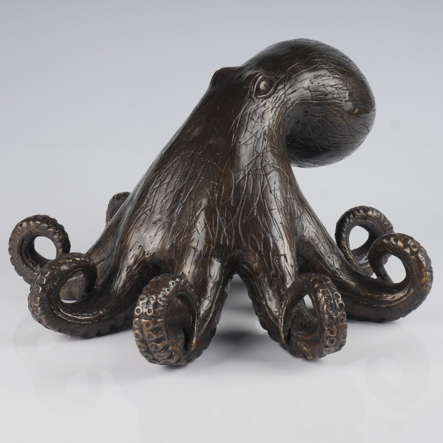 The bronze octopus hand casted brass marine art statue.