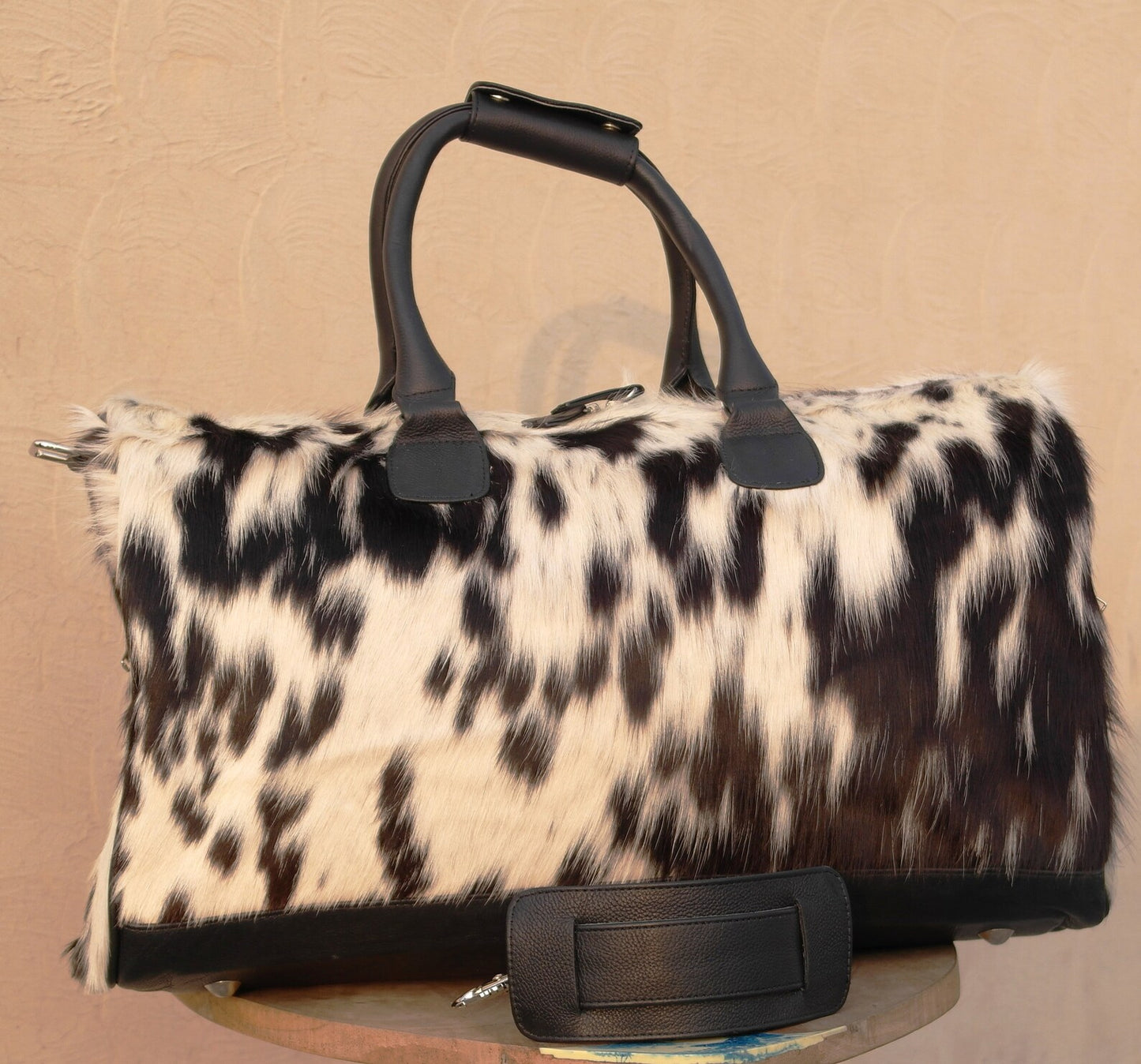 Make a statement with our cow skin travel bag, crafted for durability and style. Your perfect travel companion for any journey.