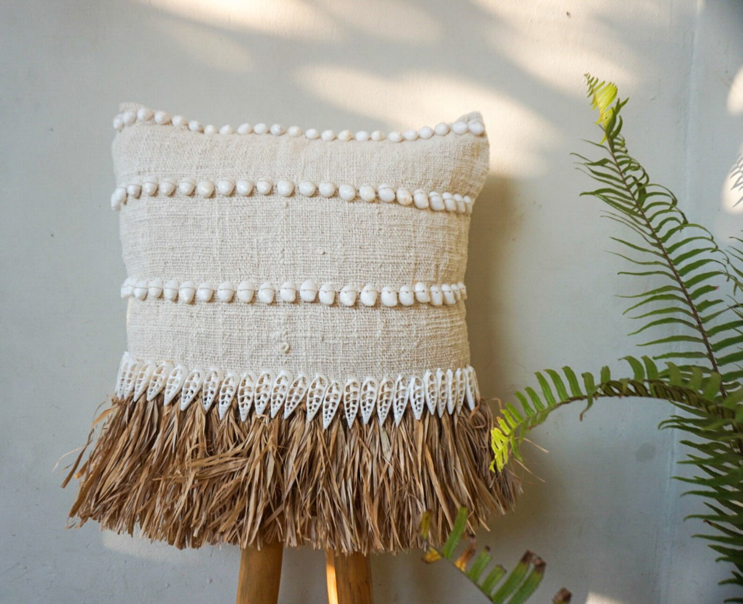 Natural raffia and white shells pillow cover