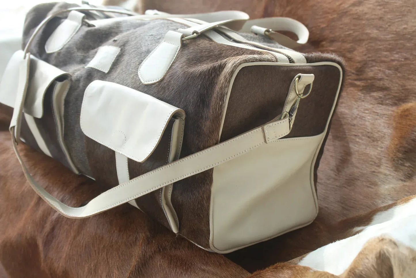 cowhide weekender bag tan grey white