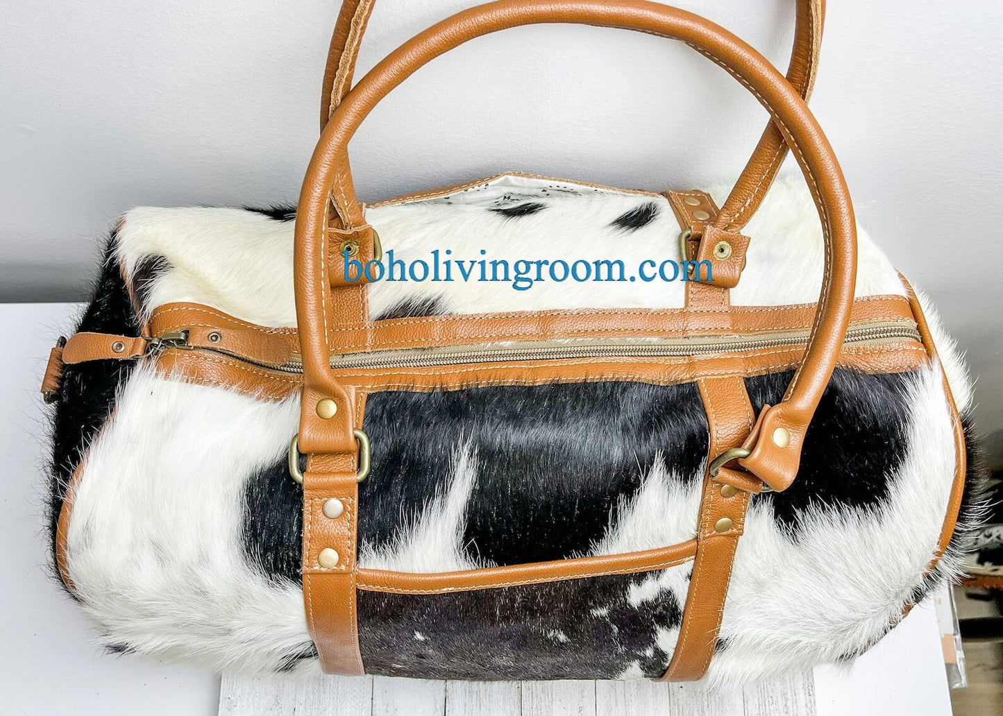 Pack for your travels with ease using our cowhide overnight bag. Durable, spacious, and designed for your convenience.