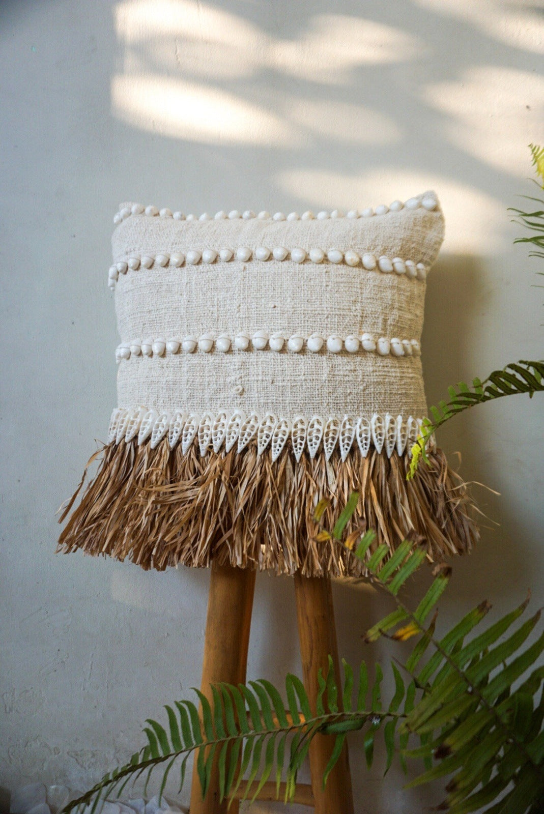 Natural raffia and white shells pillow cover