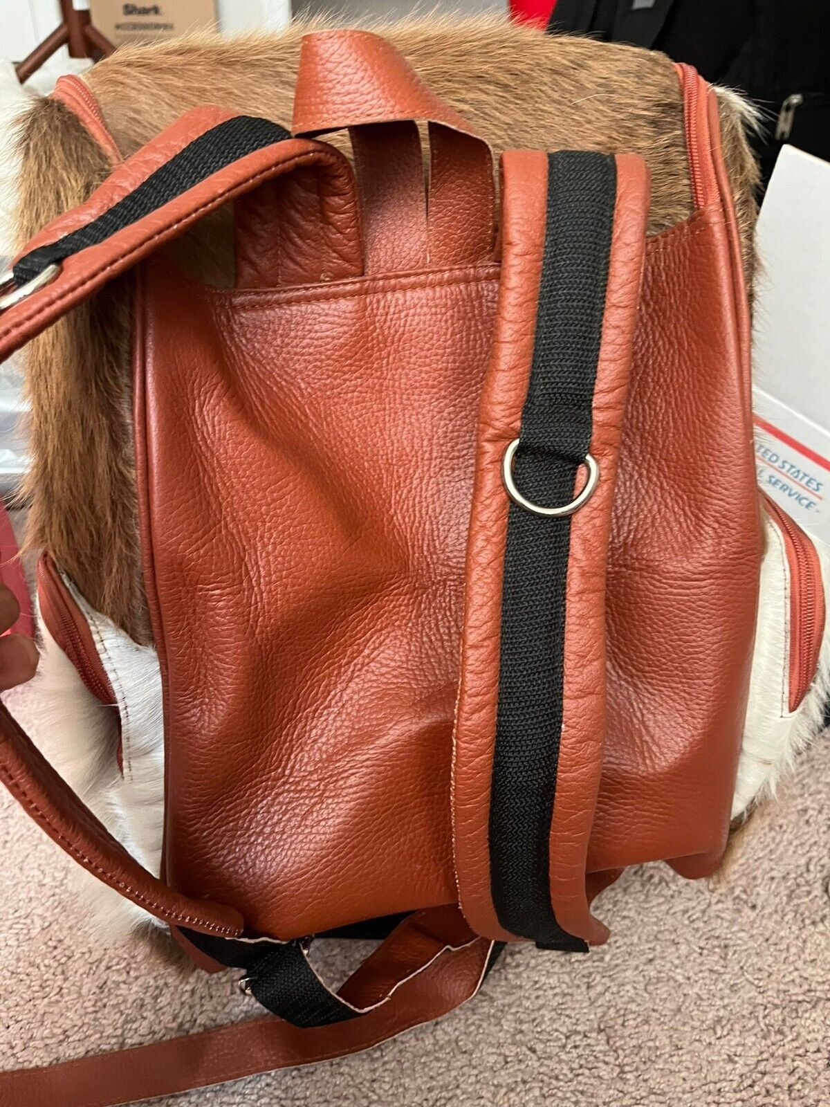 Vintage-inspired cowhide backpack with a contemporary touch, blending retro charm with modern convenience for everyday use.