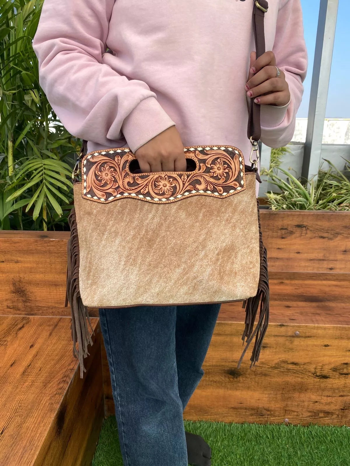 hair on cowhide and leather tooled messenger bag