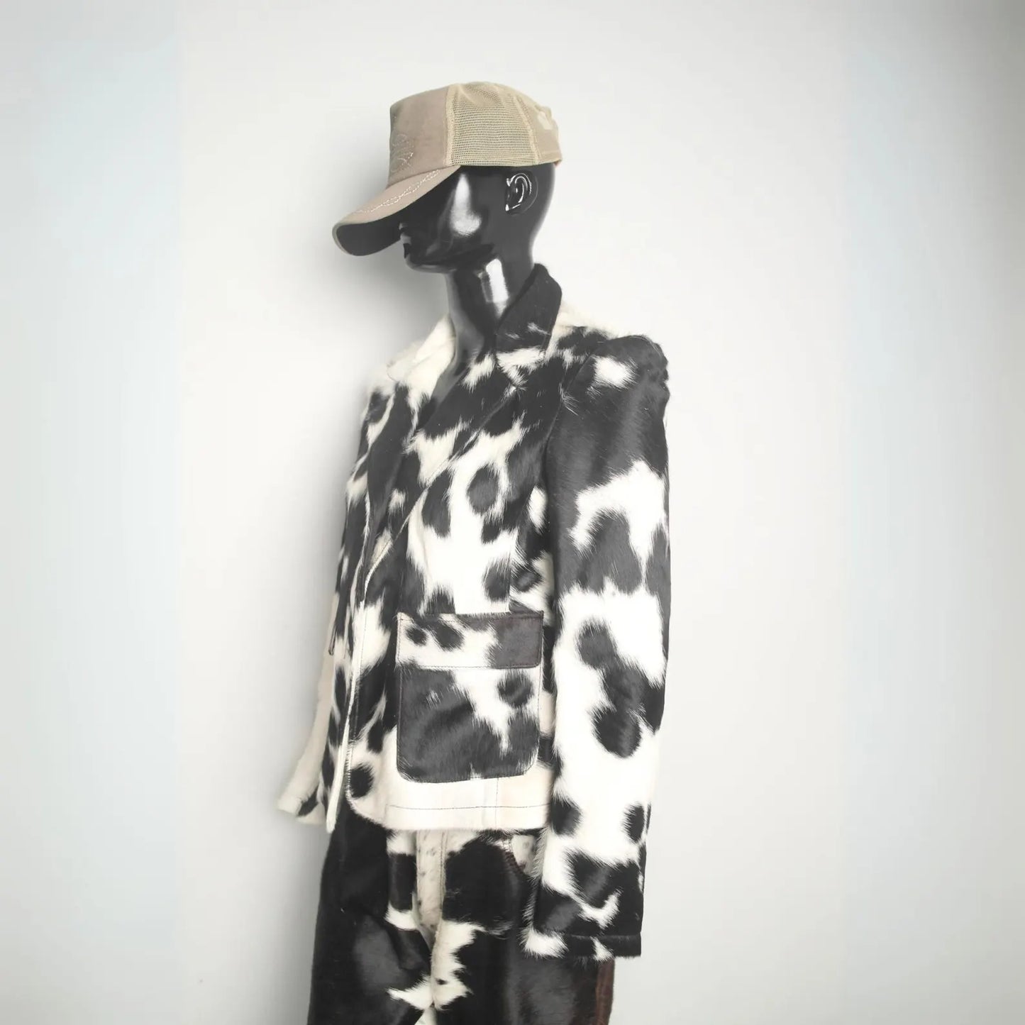 Premium cowhide leather jacket featuring natural black white hide. Rodeo-ready winter coat for men and women, designed for ranch and country lifestyle.