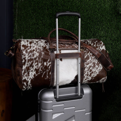 Embark on your next adventure with a chic cow fur duffle bag, blending practicality with sophistication.