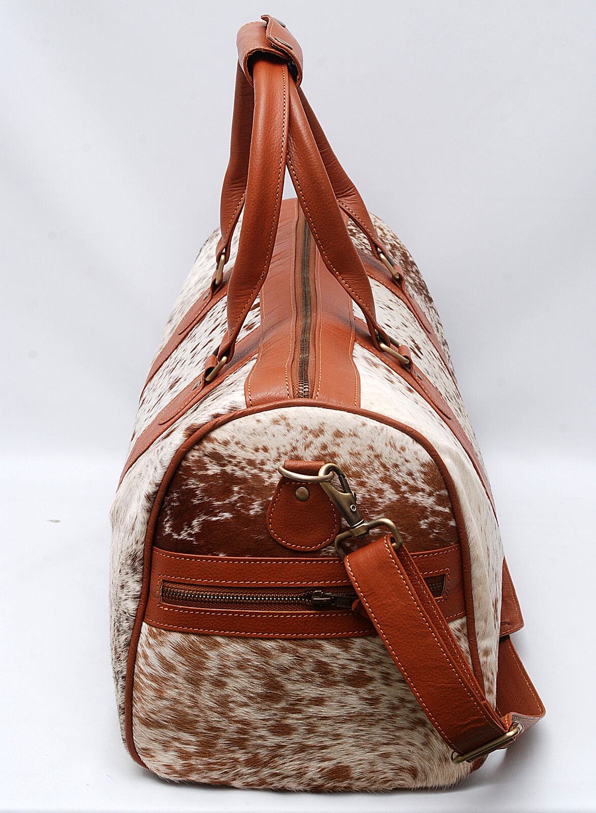 Effortlessly chic, this cowhide overnight bag is designed to accompany you on every journey, near or far.