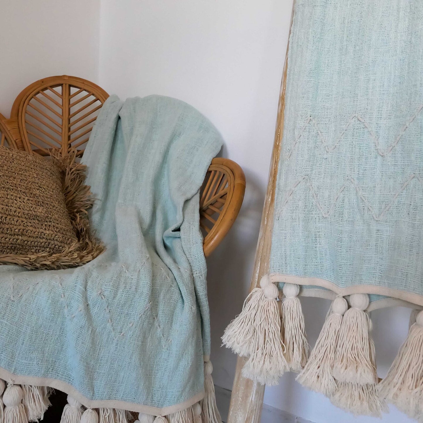 light blue organic throw blanket with pom pom