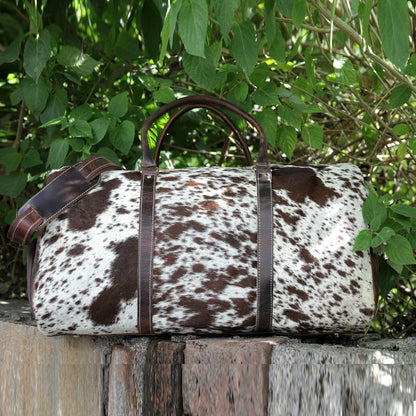 Conquer your travels with a reliable cow hide duffle bag, crafted to withstand the rigors of exploration.