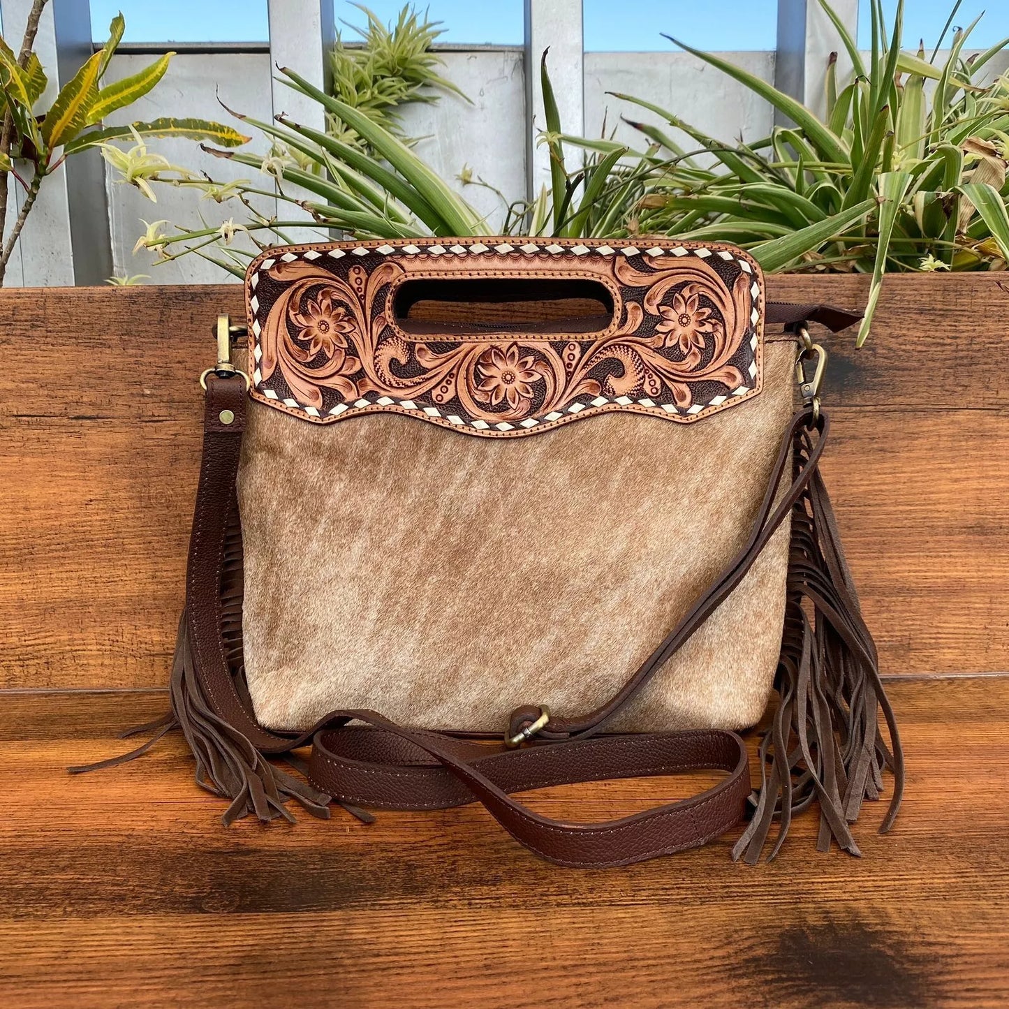 hair on cowhide and leather tooled messenger bag