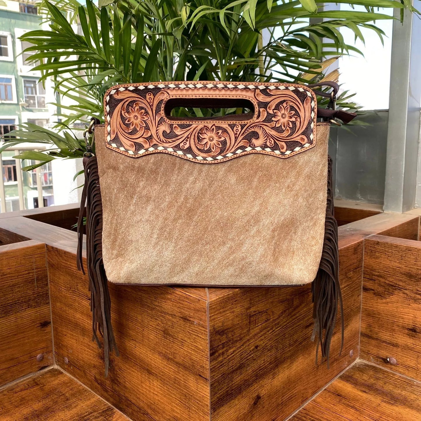 hair on cowhide and leather tooled messenger bag