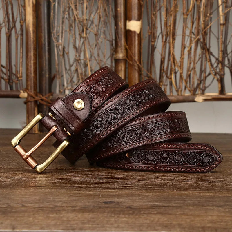 Men's full-grain leather belt Dunedin with intricate embossed detailing and a rustic brass buckle. Built for everyday jeans or classic styling.