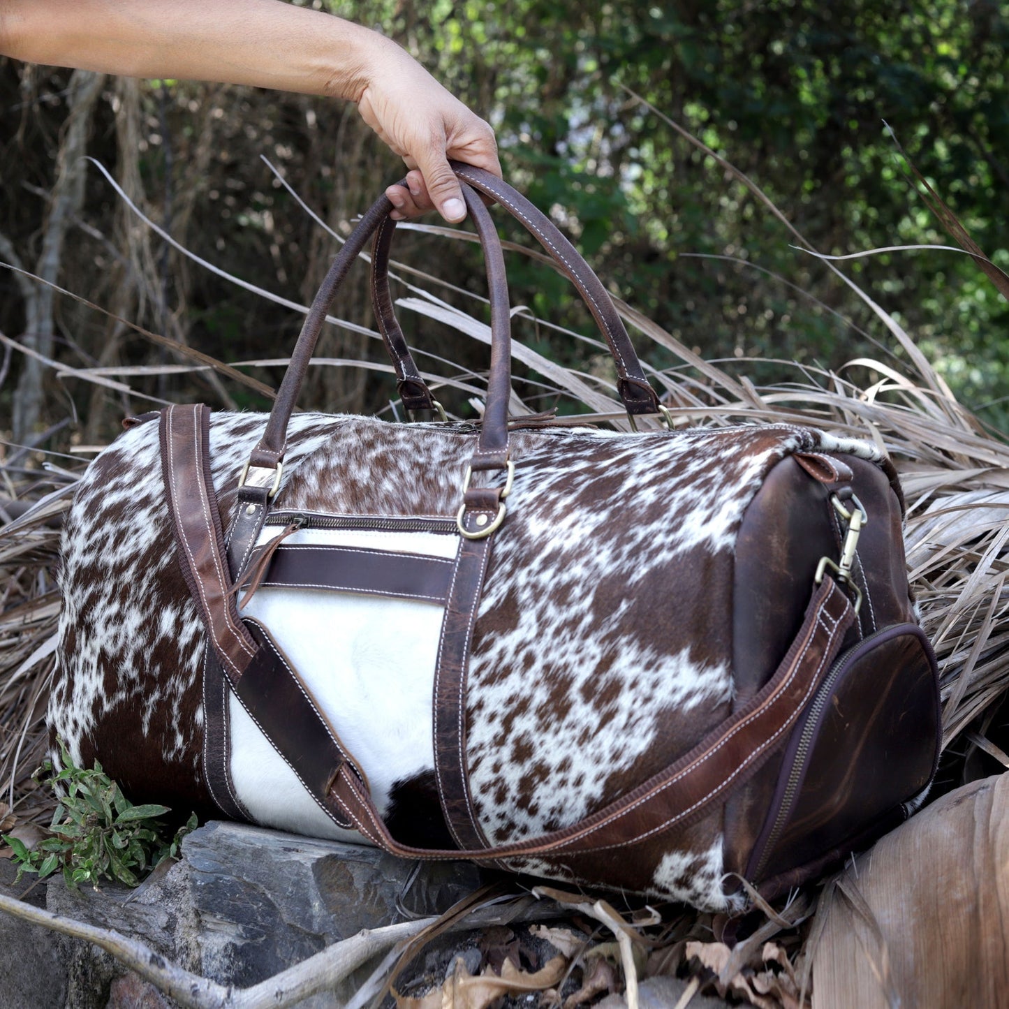 Hit the road in style with a classic cow fur weekender bag, designed for the discerning traveler.