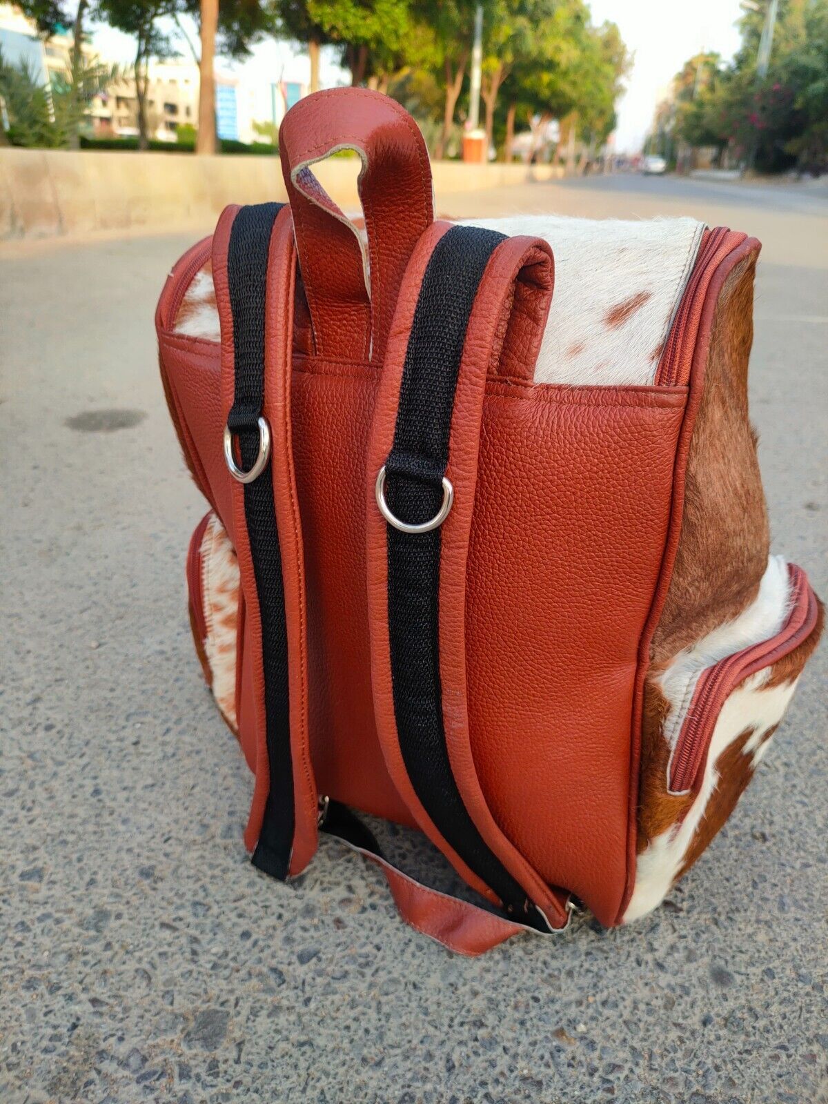 Speckled brown white cowhide travel backpack