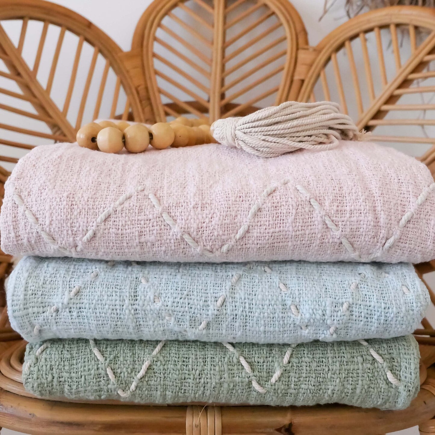 light blue organic throw blanket with pom pom