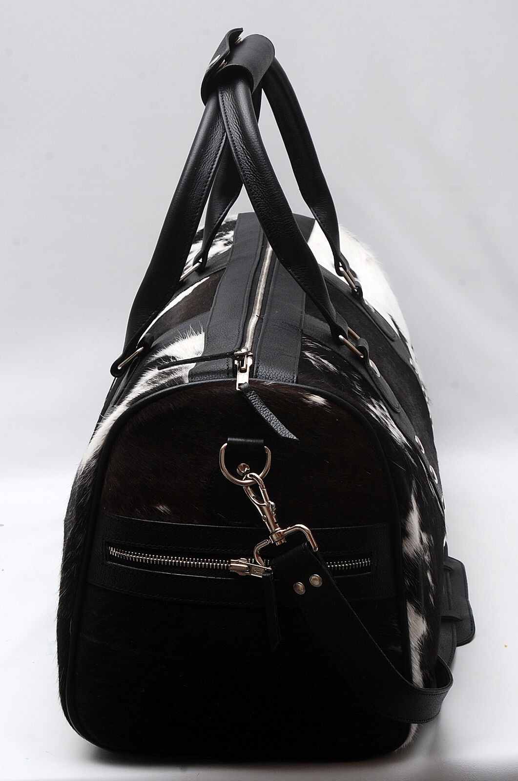 Pack for your travels with ease using our cowhide overnight bag. Durable, spacious, and designed for your convenience.