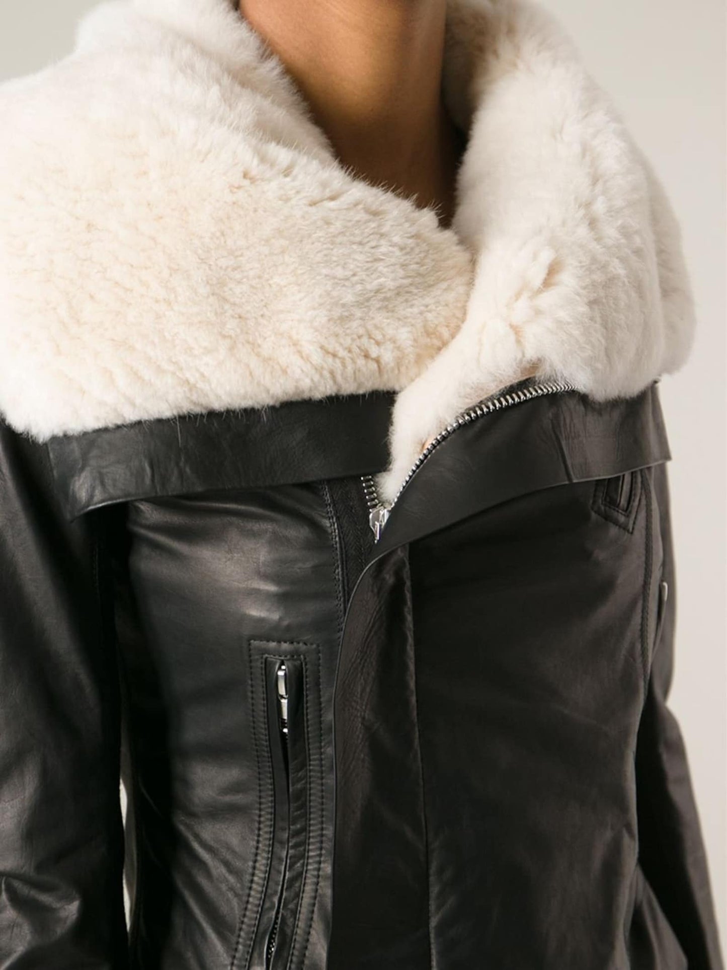 Fashionable women's leather jacket showcased on a mannequin, highlighting its sleek and trendy design.