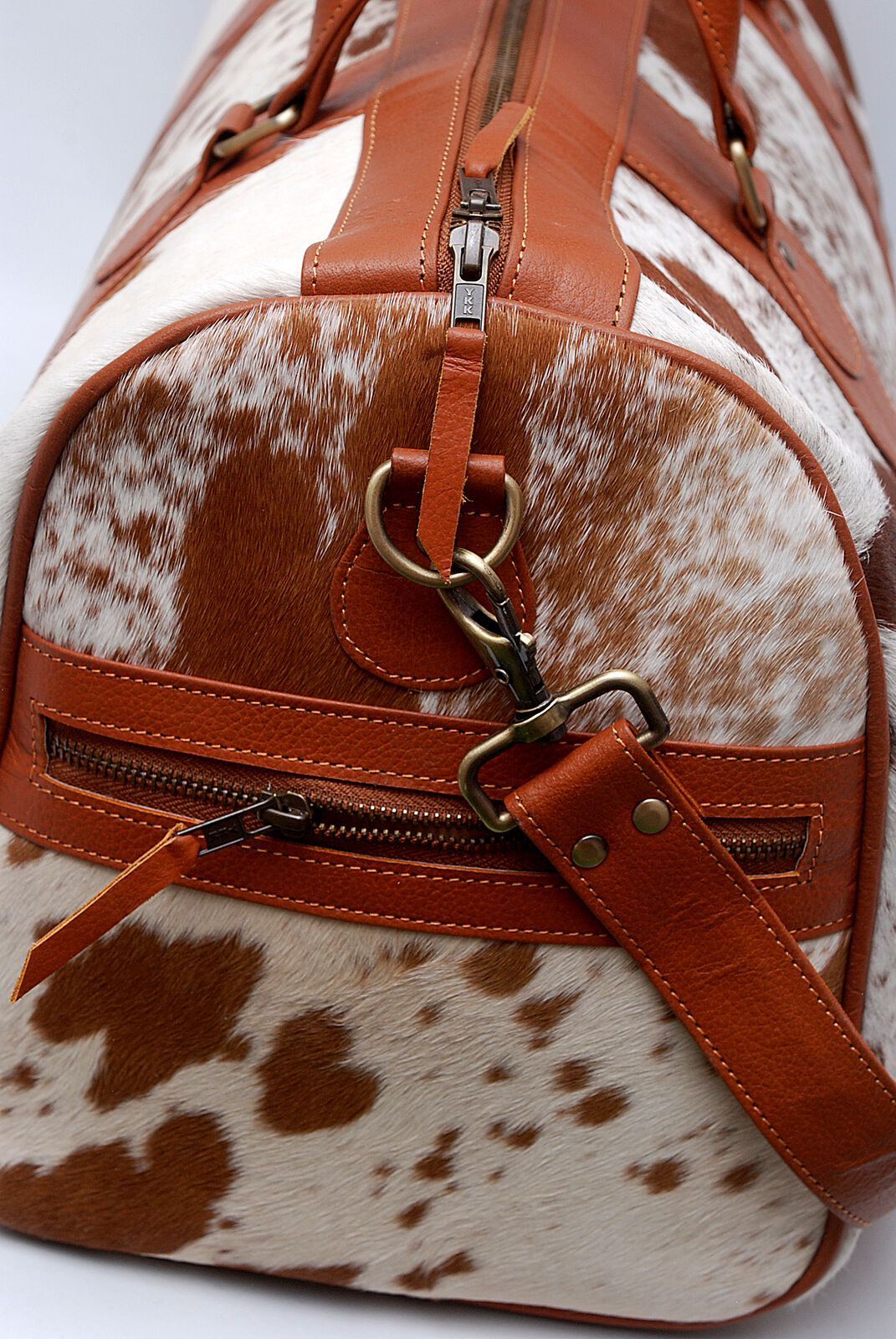Achieve peak performance with this cow skin gym bag, combining durability with sleek design.