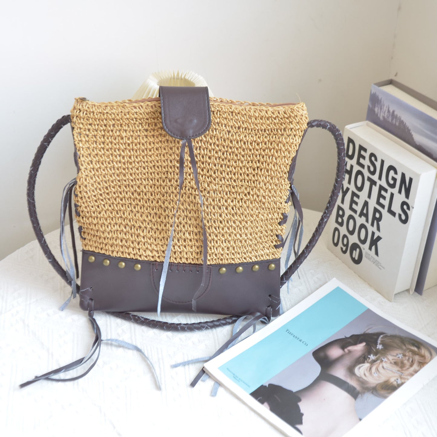 Hand-woven straw bag with leather tassel