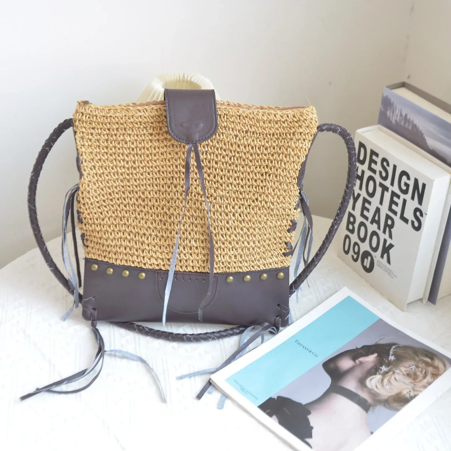 Hand-woven straw bag with leather tassel