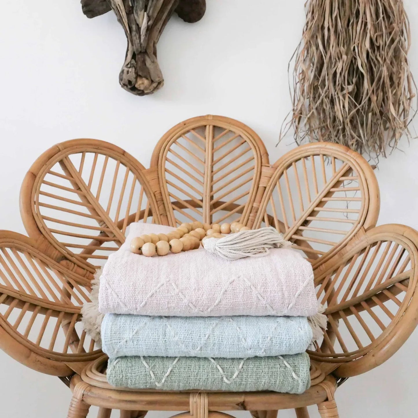 light blue organic throw blanket with pom pom