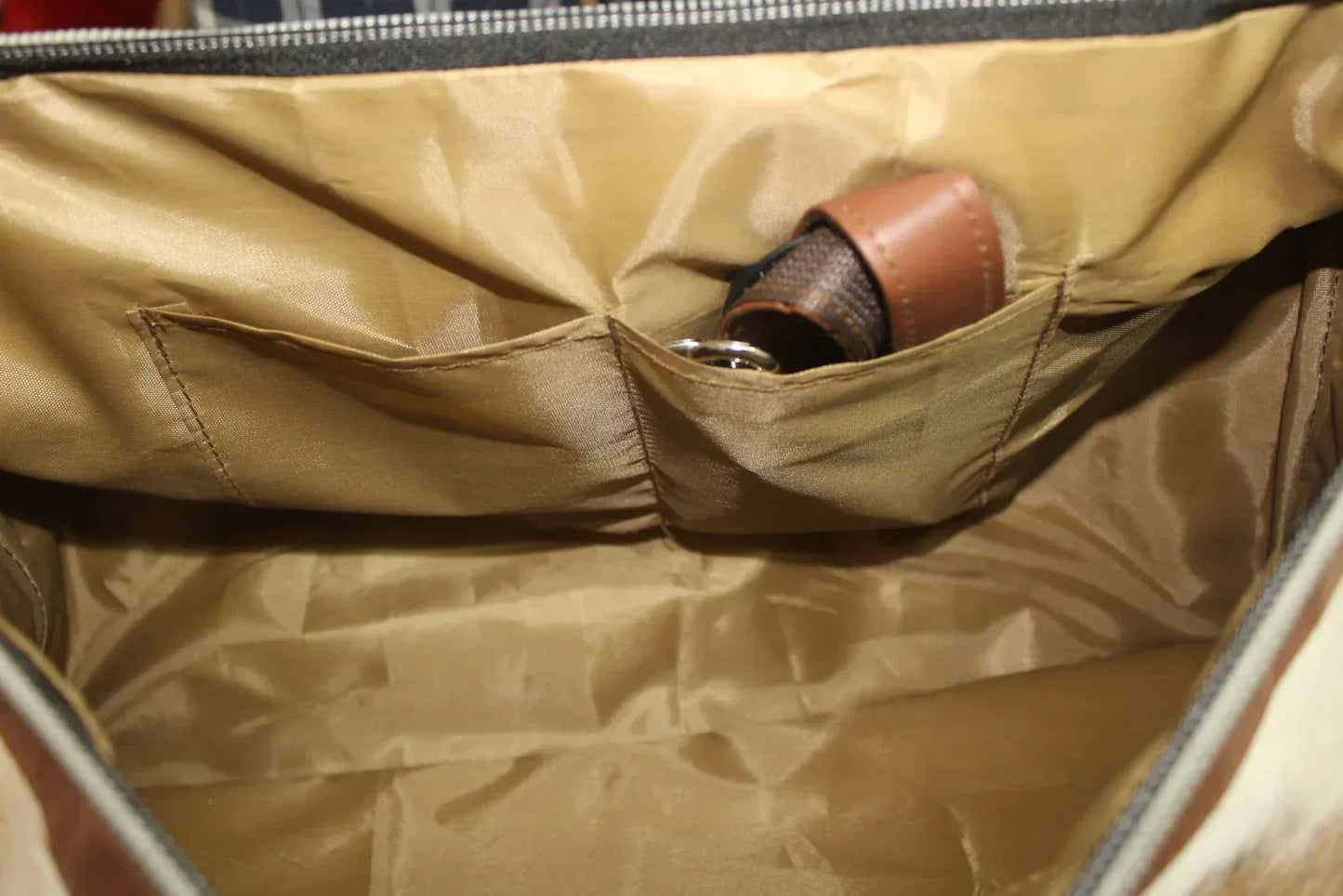 cowhide duffle bag light tan brown white