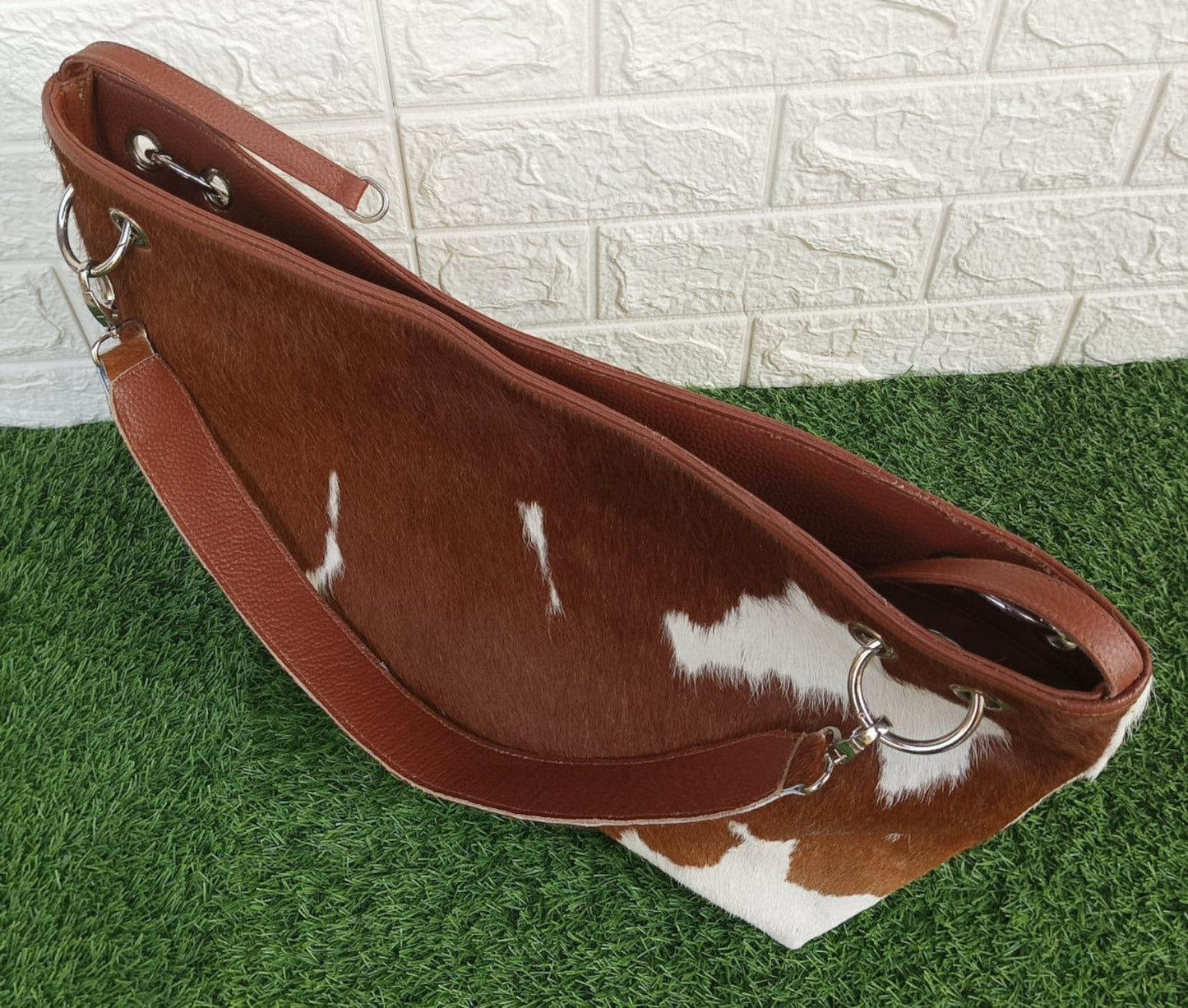 Make a statement with cowhide bag