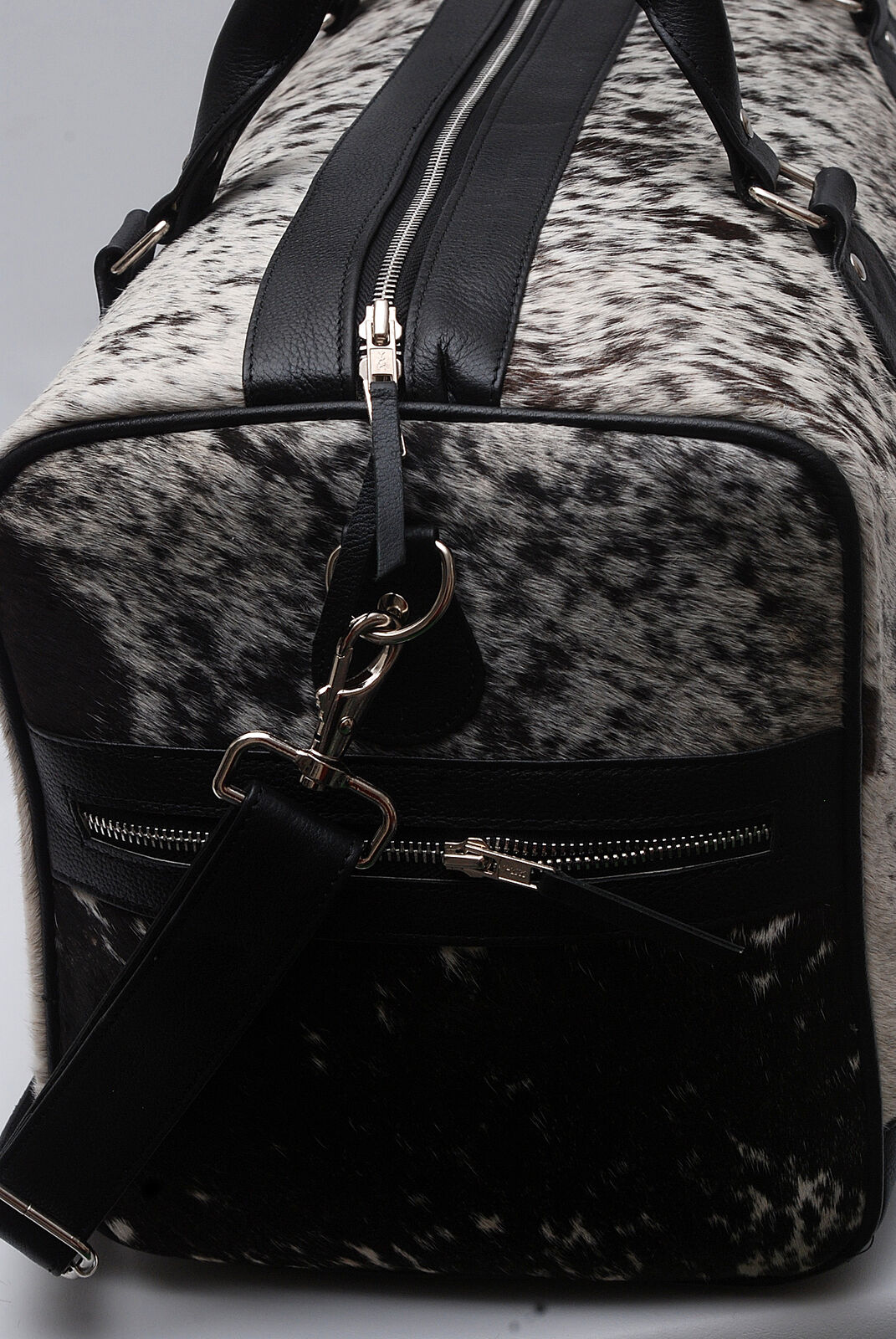 Unleash your inner explorer with this cowhide duffle bag, a symbol of adventure and refinement tailored for the modern nomad.
