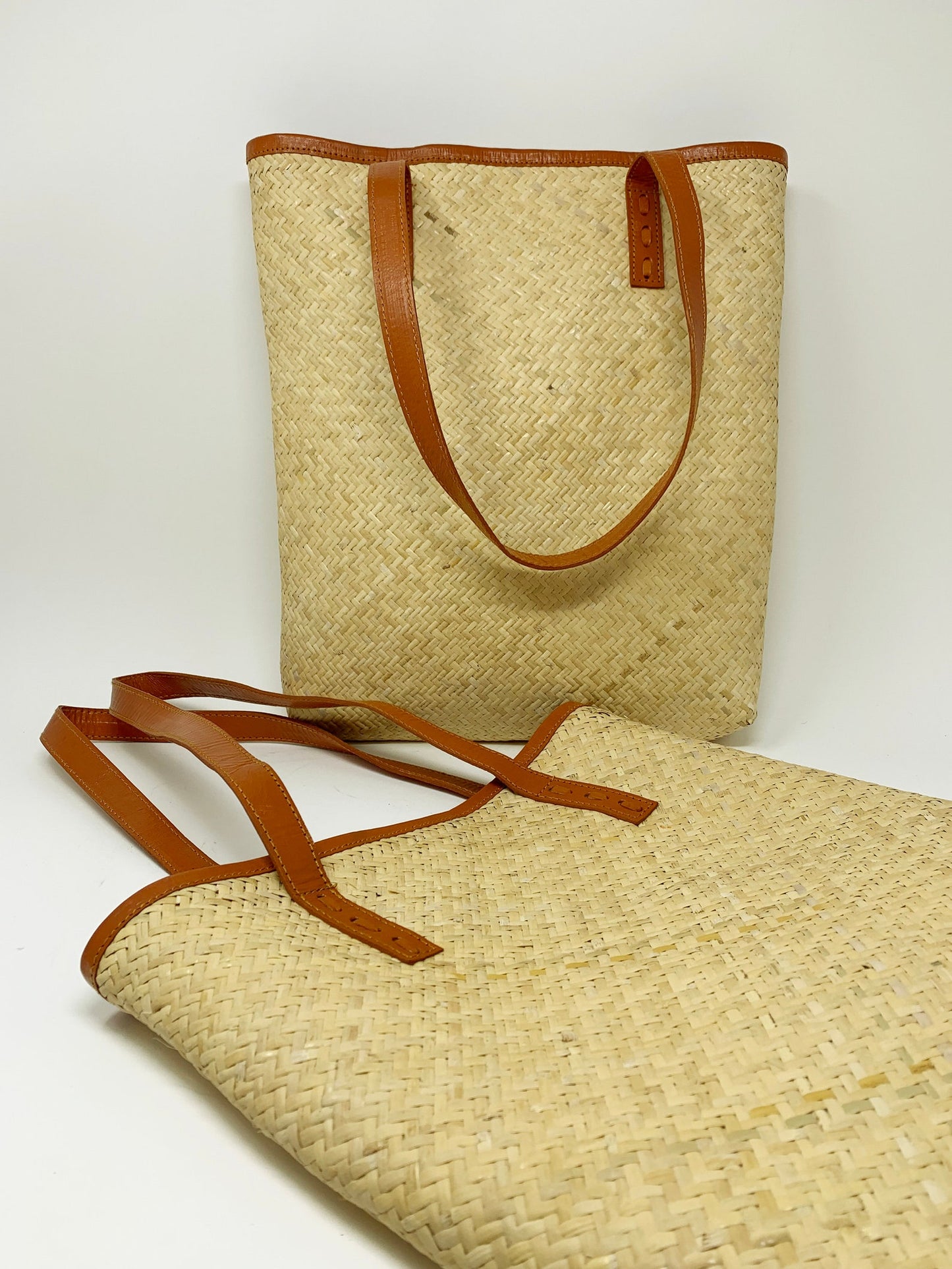 Handwoven rattan tote with leather straps