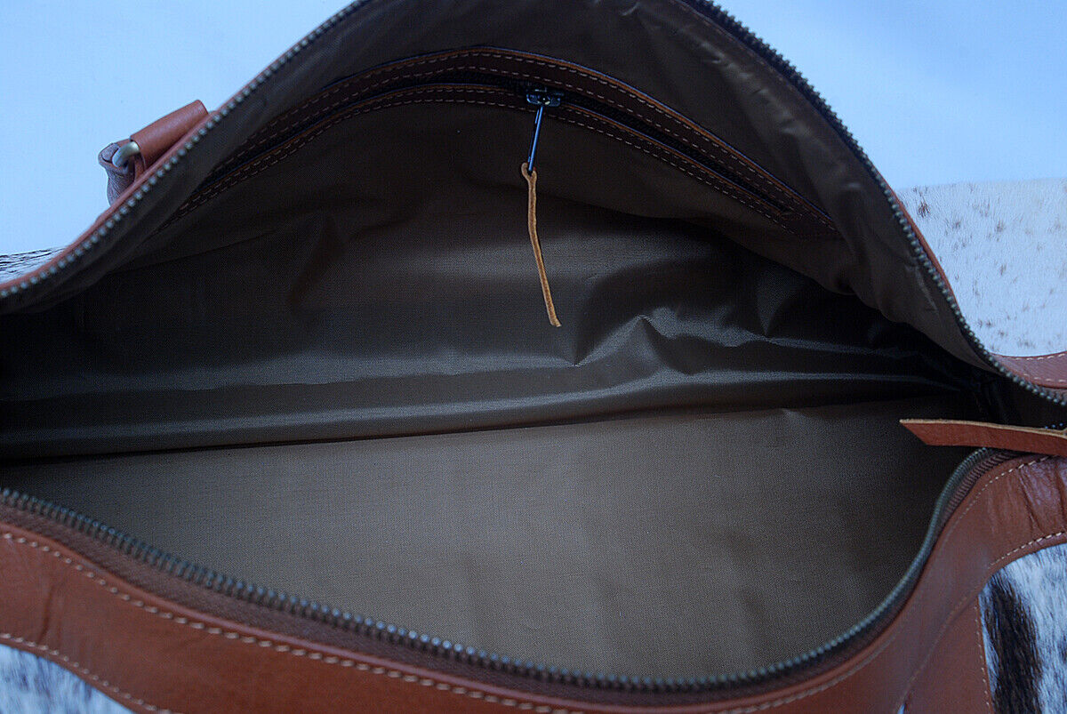 Command attention at the gym with this cowhide gym bag, a perfect blend of style and function.