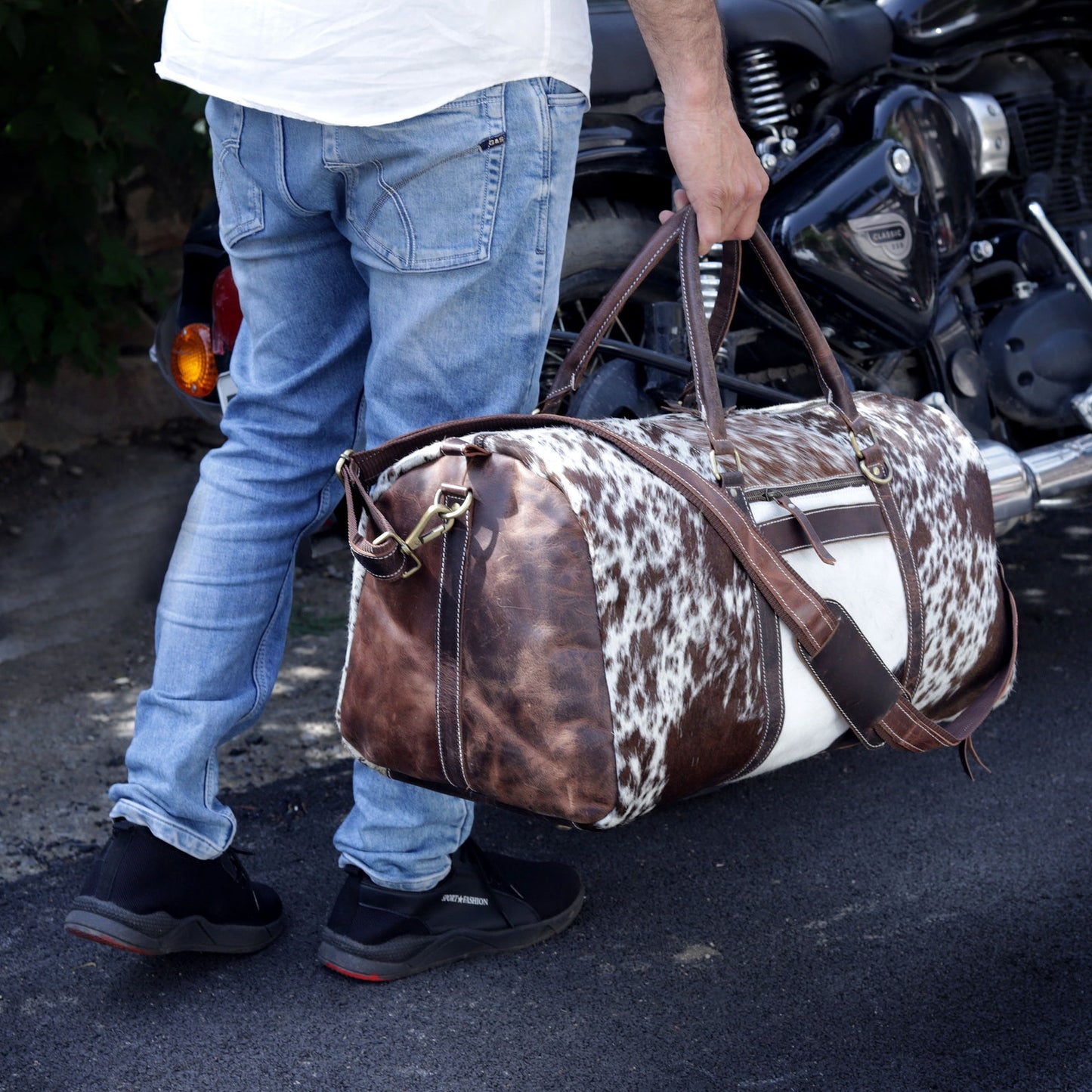 Experience the allure of exploration with a chic cow fur weekender bag, crafted for the modern traveler.