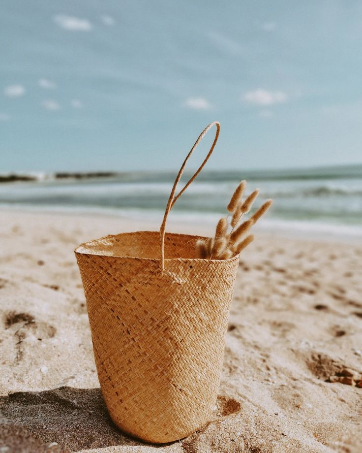 Handcrafted rattan purse with a natural finish and detailed weave.