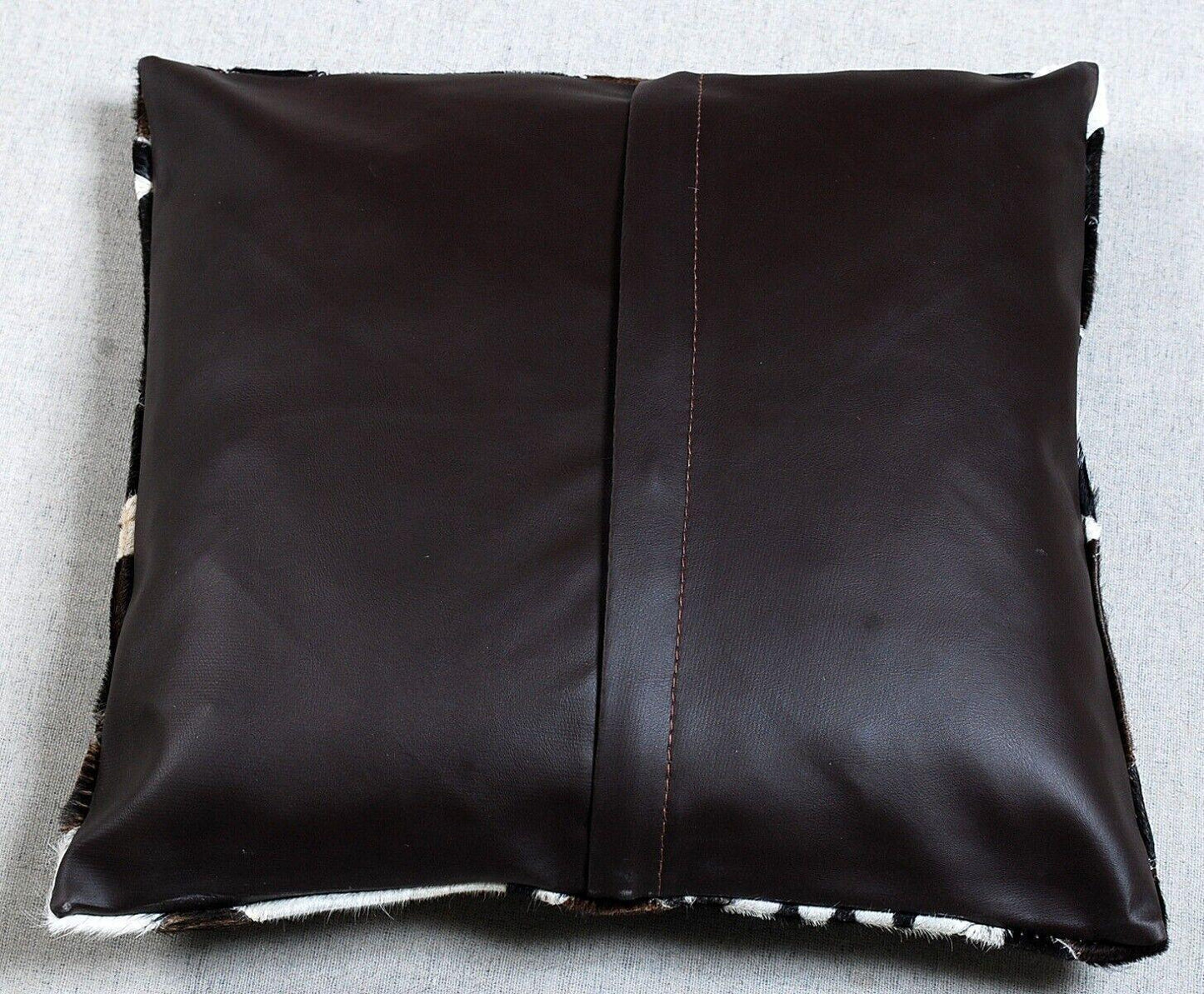 Hair on hide pillow cover with black white geometric cowhide patches