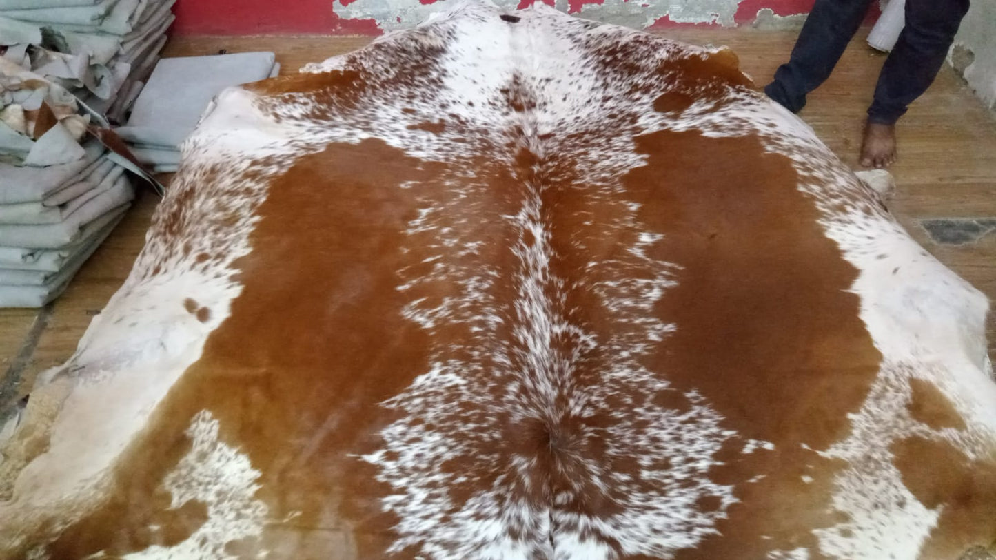 Create an inviting atmosphere in your home with our exquisite brown and white cowhide rugs, offering unparalleled softness, durability, and natural beauty.