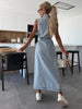 Light blue denim maxi dress New Plymouth with tie waist, front slit, and overall-style fit. A casual sleeveless jean dress for everyday summer outfits.