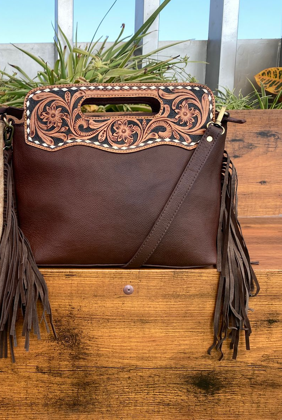 hair on cowhide and leather tooled messenger bag