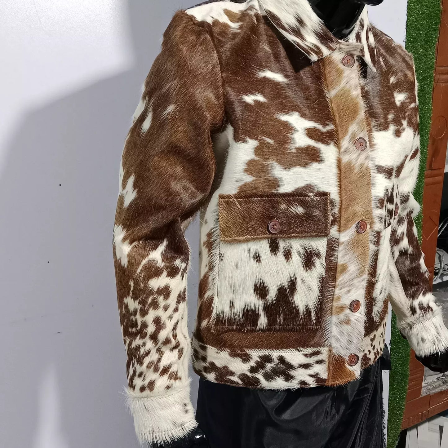 Genuine cowhide jacket made with natural hair-on-hide. Tricolor western jacket for men and women – ideal for rodeo, ranchwear, and cowboy fashion.