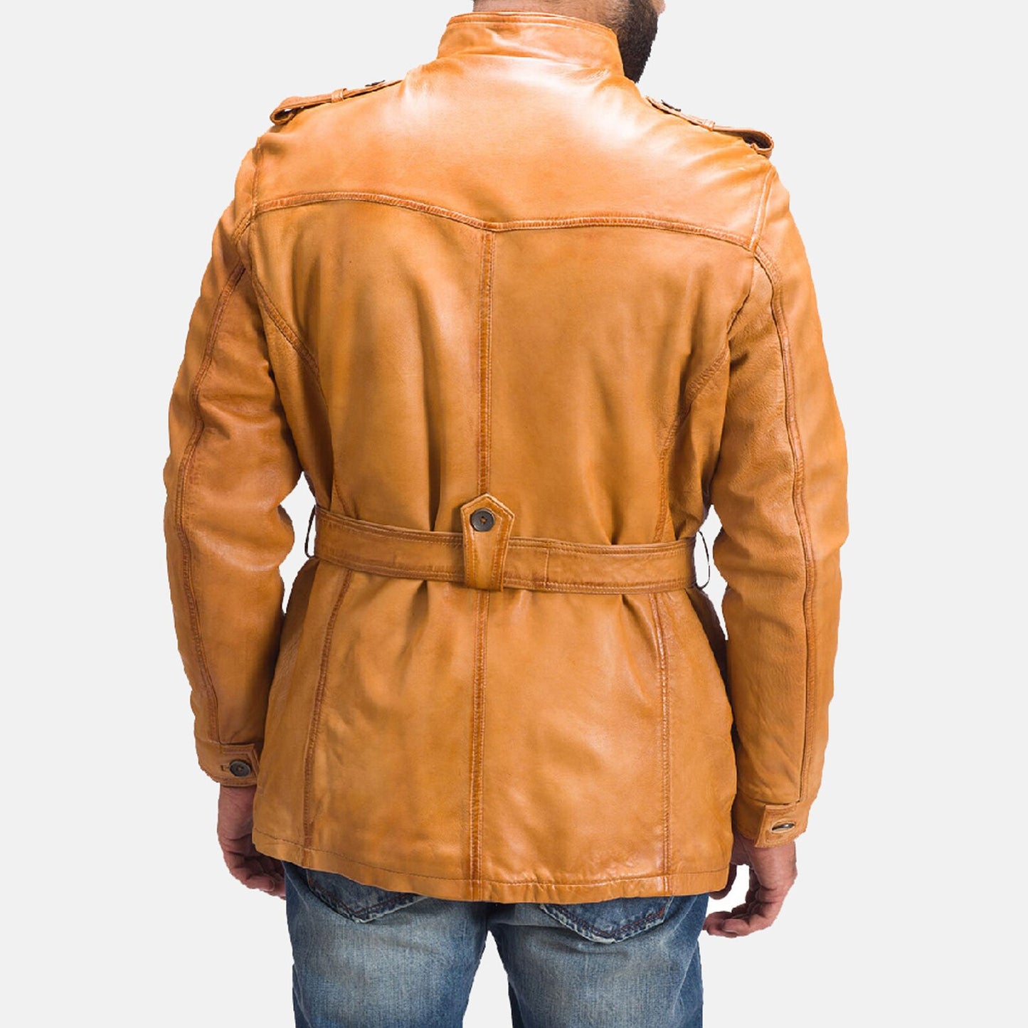 Close-up of a brown leather hunting jacket featuring durable stitching and a weathered finish.
