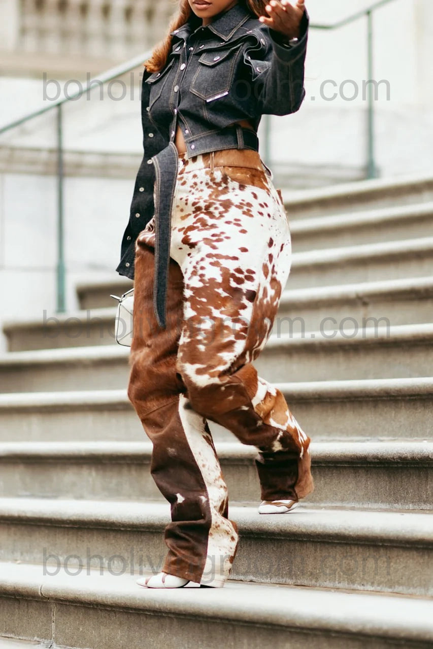 Real hair on cowhide pants for women in brown and white cow print, perfect for rodeo events, western wear, and bold country looks. One-of-a-kind pattern and comfort.