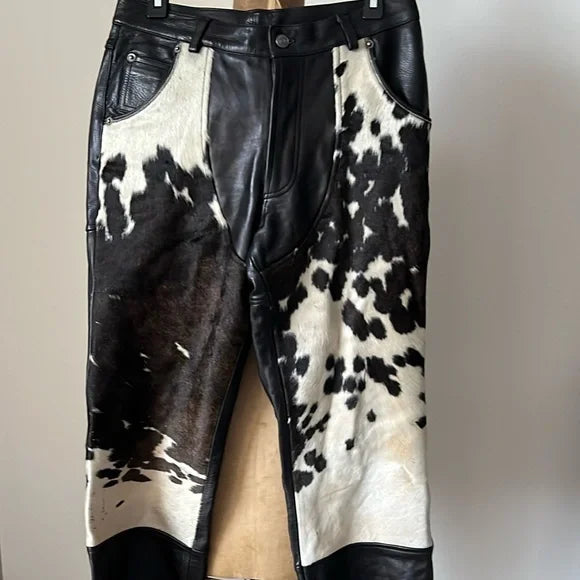 Textured cowhide fur and leather come together in these trousers, creating a bold statement. A mix of materials makes them a unique pick for those who like to stand apart.