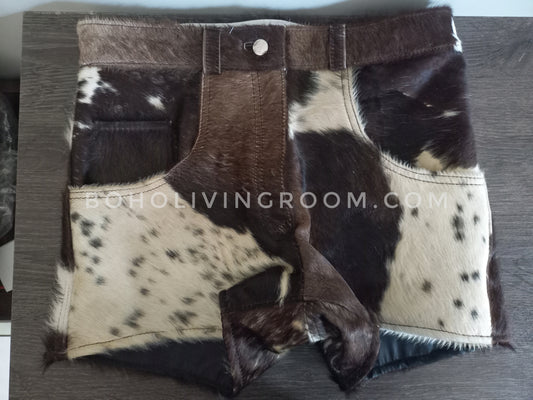 Real cow skin shorts with tricolor black, brown, and white cow print. Designed for cow print shorts men and women wanting standout rodeo or festival style.
